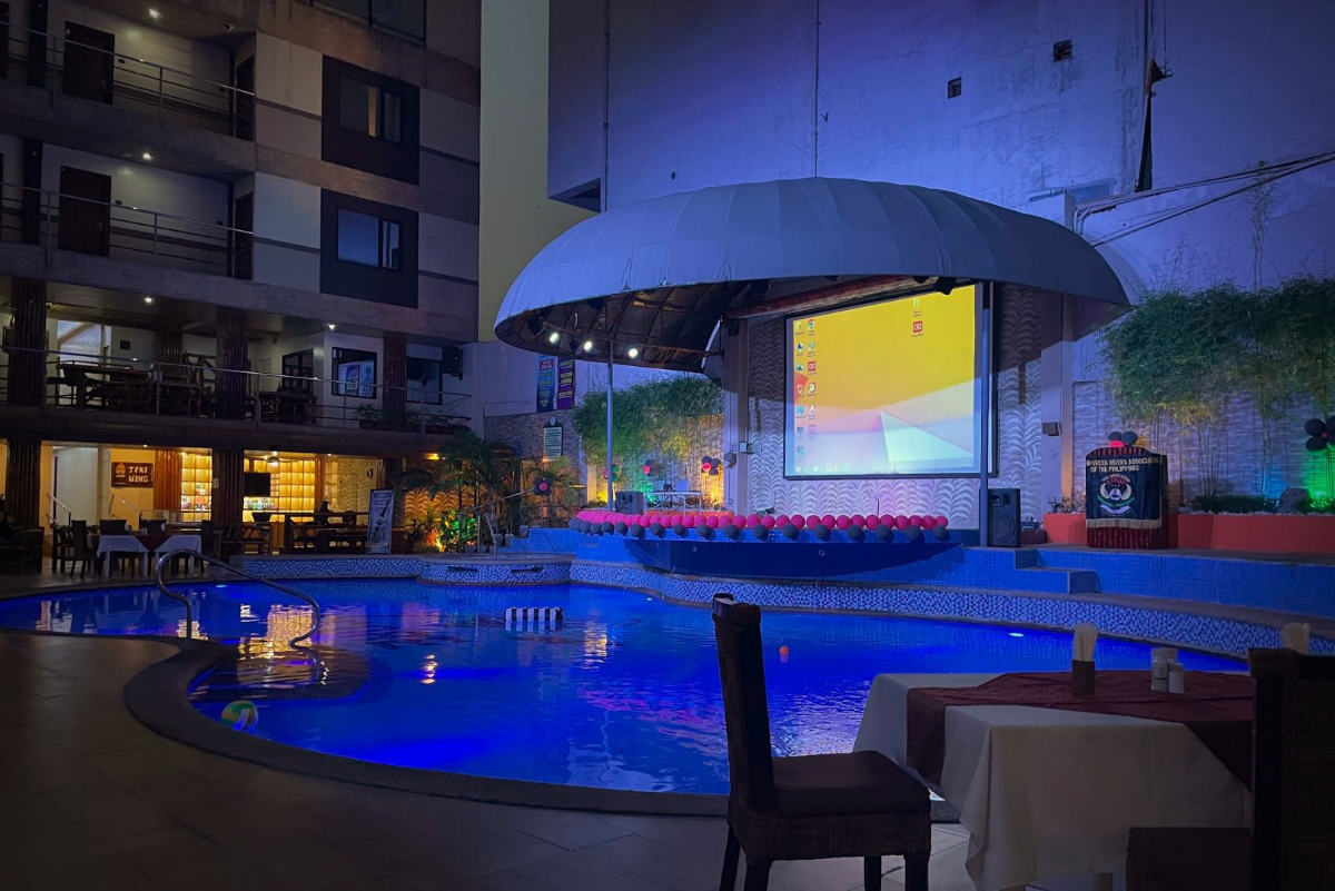 ScoreBirds Hotel pool area — evening at the tropical resort